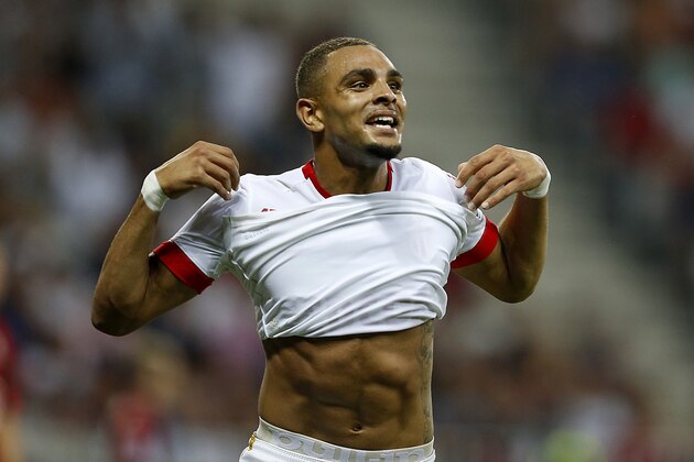 Monaco's French defender Layvin Kurzawa celebrates after scoring his team's second goal during the French L1 football match between Nice and Monaco at the Allianz Riviera stadium in Nice, southeastern France, on August 8, 2015.  AFP PHOTO / VALERY HACHE        (Photo credit should read VALERY HACHE/AFP/Getty Images)