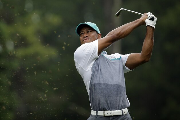 Tiger Woods hits to the 13th hole during the first round of the Wyndham Championship golf tournament in Greensboro, N.C., Thursday, Aug. 20, 2015. (AP Photo/Chuck Burton) Tiger Woods hits to the 13th hole during the first round of the Wyndham Championship golf tournament in Greensboro, N.C., Thursday, Aug. 20, 2015. (AP Photo/Chuck Burton)