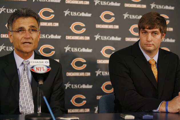 Chicago Bears' new quarterback Jay Cutler, right, listens to general manager Jerry Angelo's speech during a news conference, Friday, April 3, 2009, in Lake Forest, Ill. (AP Photo/Nam Y. Huh)