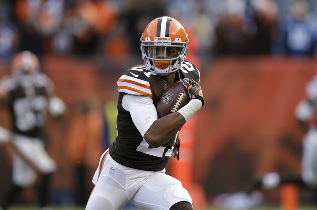 Cleveland Browns cornerback Justin Gilbert returns in interception for a touchdown against the Indianapolis Colts in the third quarter of an NFL football game Sunday, Dec. 7, 2014, in Cleveland. (AP Photo/Tony Dejak)