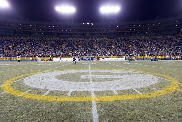 Nov 30, 2014; Green Bay, WI, USA; The Green Bay Packers logo at midfield of Lambeau Field following the game between the New England Patriots and Green Bay Packers.  Green Bay won 26-21.  Mandatory Credit: Jeff Hanisch-USA TODAY Sports