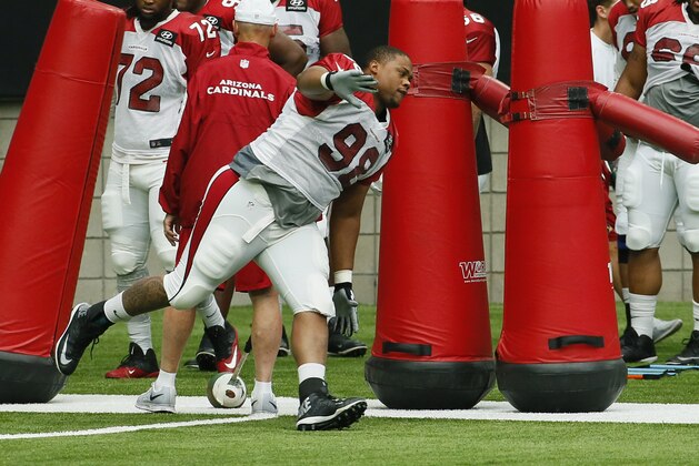 Arizona Cardinals' Corey Peters (98) works out during an NFL football training camp, Wednesday, Aug. 5, 2015, in Glendale, Ariz. (AP Photo/Matt York)