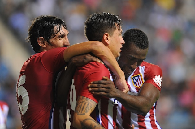 Atletico Madrid's Uruguayan defender Jose Maria Gimenez (C) celebrates after scoring with Atletico Madrid's Colombian forward  Jackson Martínez (R) and Atletico Madrid's Montenegrin defender Stefan Savic (L) during the Trofeo Carranza football match Atletico de Madrid vs Betis at the Ramon de Carranaza stadium in Cadiz on August 15, 2015. AFP PHOTO / CRISTINA QUICLER        (Photo credit should read CRISTINA QUICLER/AFP/Getty Images)
