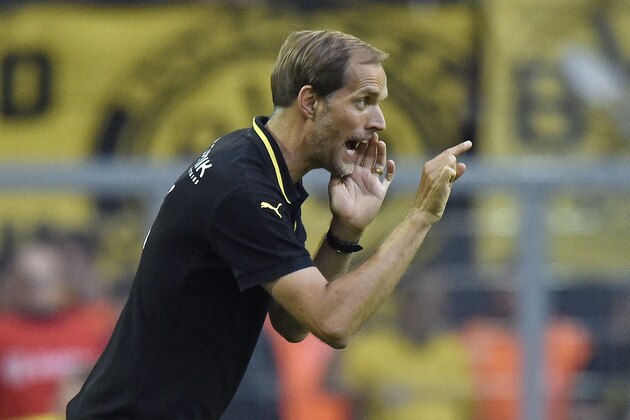 Dortmund head coach Thomas Tuchel shouts to his team during the German Bundesliga soccer match between Borussia Dortmund and Borussia Moenchengladbach in Dortmund, Germany, Saturday, Aug. 15, 2015. (AP Photo/Martin Meissner)