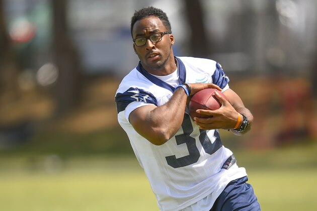 Dallas Cowboys running back Lache Seastrunk (30) takes a handoff as the offense runs plays during Dallas Cowboys' NFL training camp, Friday, July 31, 2015, in Oxnard, Calif. (AP Photo/Gus Ruelas)