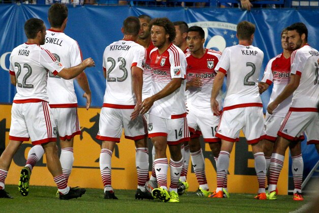 Aug 8, 2015; Montreal, Quebec, CAN; D.C. United forward Chris Rolfe (18) celebrates his goal against Montreal Impact with teammates during the first half at Stade Saputo. Mandatory Credit: Jean-Yves Ahern-USA TODAY Sports