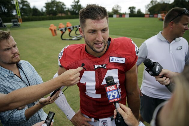 Philadelphia Eagles quarterback Tim Tebow speaks with members of the media after NFL football training camp, Thursday, Aug. 20, 2015, in Philadelphia. (AP Photo/Matt Rourke)