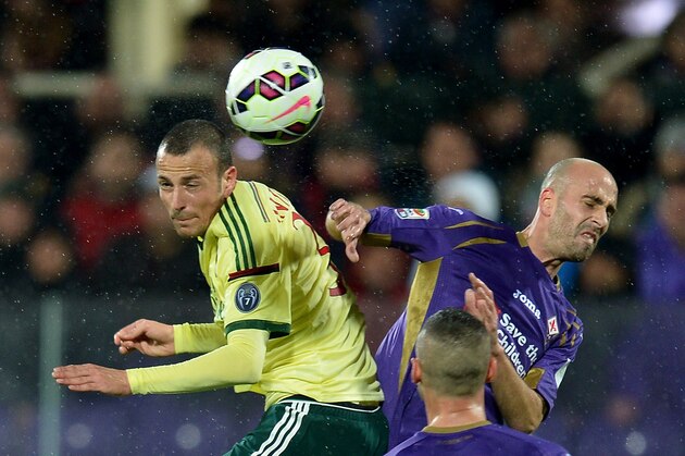 Fiorentina's midfielder from Spain Borja Valero (R) fights for the ball with  AC Milan's defender Luca Antonelli during the Italian Serie A football match  Fiorentina vs AC Milan on March 16, 2015 at Artemio Franchi stadium in Florence. AFP PHOTO / ALBERTO PIZZOLI        (Photo credit should read ALBERTO PIZZOLI/AFP/Getty Images)