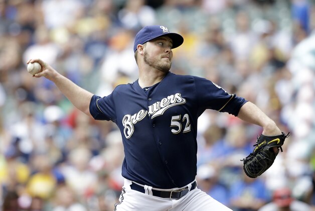 Milwaukee Brewers starting pitcher Jimmy Nelson throws to the St. Louis Cardinals in the first inning of a baseball game, Sunday, Aug. 9, 2015, in Milwaukee. (AP Photo/Jeffrey Phelps)