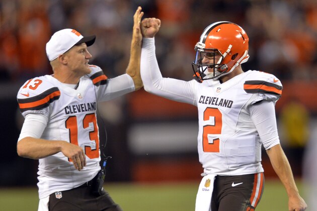 Cleveland Browns quarterback Josh McCown (13) congratulates Johnny Manziel (2) after Manziel threw a 21-yard touchdown pass to Shane Wynn during the fourth quarter of an NFL preseason football game against the Buffalo Bills, Thursday, Aug. 20, 2015, in Cleveland. (AP Photo/David Richard)