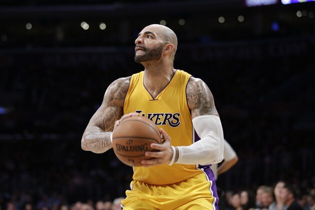 Los Angeles Lakers' Carlos Boozer looks to shoot during the second half of an NBA basketball game against the Utah Jazz, Thursday, March 19, 2015, in Los Angeles. The Jazz 80-73. (AP Photo/Jae C. Hong)