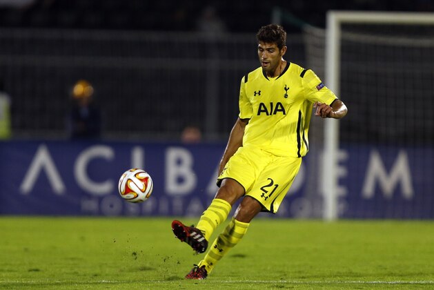 Tottenham Hotspur's Federico Fazio passes the ball during the Europa League Group C soccer match between Partizan Belgrade and Tottenham Hotspur in Belgrade, Serbia, Thursday, Sept. 18, 2014. (AP Photo/Marko Drobnjakovic)