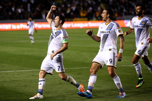 LOS ANGELES, CA - MARCH 06:  Robbie Keane #7 of the Los Angeles Galaxy celebrates with Alan Gordon #9 and Baggio Husidic #6 after scoring the Galaxy's second goal in the second half against the Chicago Fire at StubHub Center on March 6, 2015 in Los Angeles, California. The Galaxy won 2-0.  (Photo by Stephen Dunn/Getty Images)
