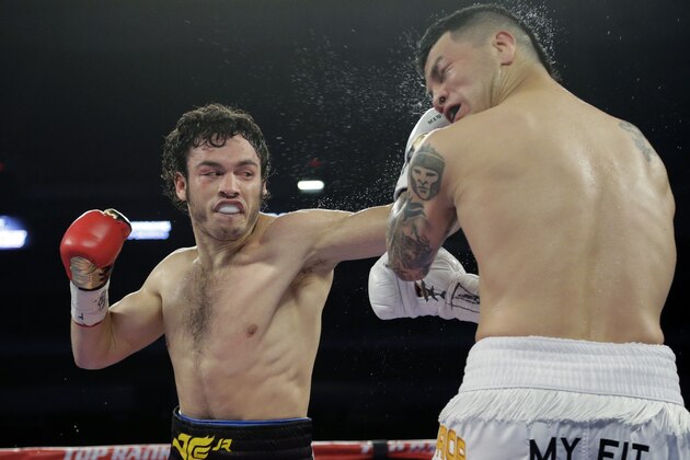 Julio Cesar Chavez Jr., left, and Bryan Vera, right, during a 12-round super middleweight bout, Saturday, March 1, 2014, in San Antonio. Chavez won by decision. (AP Photo/Eric Gay)