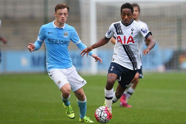MANCHESTER, ENGLAND - AUGUST 14:  Kyle Walker-Peters of Tottenham Hotspur U21 beats Brandon Barker of Manchester City U21 during the Barclays U21 Premier League match between Manchester City U21 and Tottenham Hotspur U21 at The Academy Stadium on August 14, 2015 in Manchester, England.  (Photo by Alex Livesey/Getty Images)