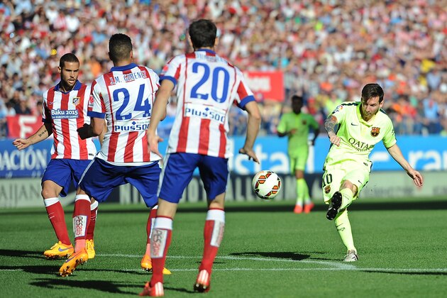 MADRID, SPAIN - MAY 17:  Lionel Messi of  FC Barcelona has a shot at goal during the La Liga match between Club Atletico de Madrid and FC Barcelona at Vicente Calderon Stadium on May 17, 2015 in Madrid, Spain.  (Photo by Denis Doyle/Getty Images)