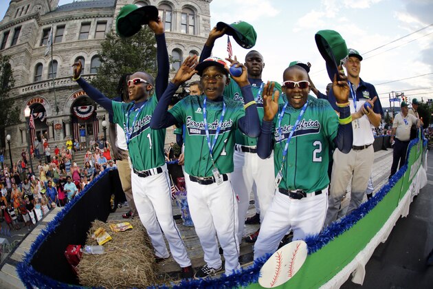 Members of the Little League team from Uganda ride in the Little League Grand Slam Parade in downtown Williamsport, Pa., Wednesday, Aug. 19, 2015. The Little League World Series tournament gets started, Thursday, August 20, in South Williamsport, Pa.. AP Photo/Gene J. Puskar). Members of the Little League team from Uganda ride in the Little League Grand Slam Parade in downtown Williamsport, Pa., Wednesday, Aug. 19, 2015. The Little League World Series tournament gets started, Thursday, August 20, in South Williamsport, Pa.. AP Photo/Gene J. Puskar).