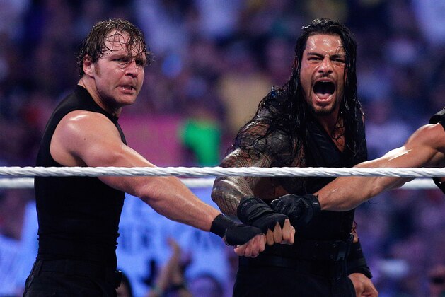 The Shield reacts after their win during Wrestlemania XXX at the Mercedes-Benz Super Dome in New Orleans on Sunday, April 6, 2014. (Jonathan Bachman/AP Images for WWE)