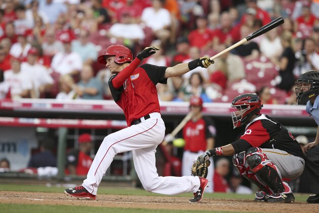 United States' Trea Turner hits a triple during the eighth inning of the All-Star Futures baseball game against Team World, Sunday, July 12, 2015, in Cincinnati. (AP Photo/John Minchillo)