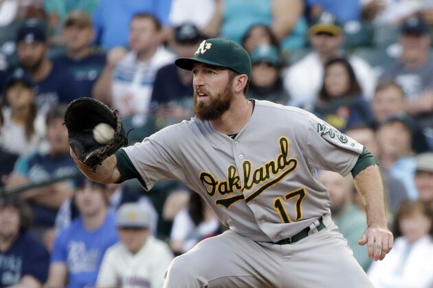 Oakland Athletics' Ike Davis in action against the Seattle Mariners in a baseball game Friday, May 8, 2015, in Seattle. (AP Photo/Elaine Thompson)