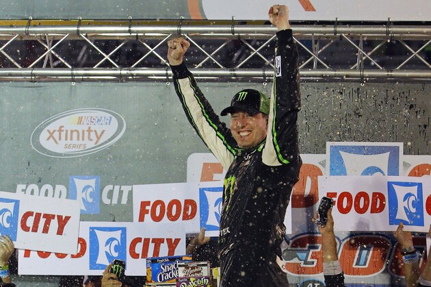 Kyle Busch celebrates in Victory Lane after winning the NASCAR Xfinity Series auto race Friday, Aug. 21, 2015, in Bristol, Tenn. (AP Photo/Wade Payne)