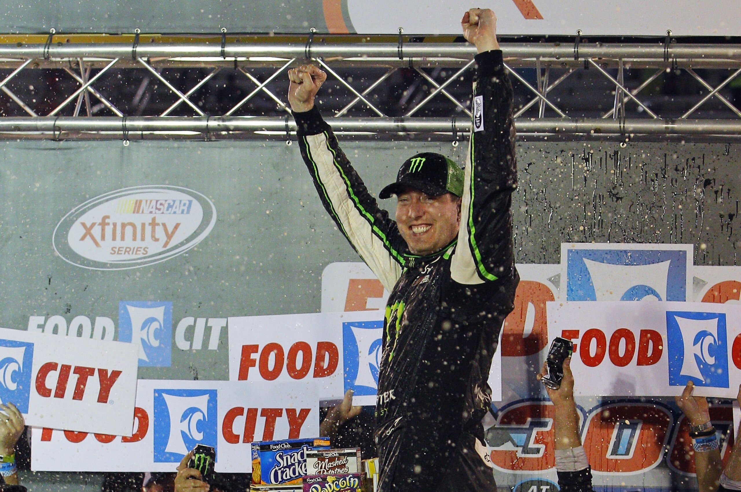 Kyle Busch celebrates in Victory Lane after winning the NASCAR Xfinity Series auto race Friday, Aug. 21, 2015, in Bristol, Tenn. (AP Photo/Wade Payne)