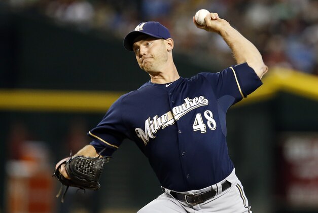 Milwaukee Brewers relief pitcher Neal Cotts throws in the eighth inning during a baseball game against the Arizona Diamondbacks, Sunday, July 26, 2015, in Phoenix. (AP Photo/Rick Scuteri)