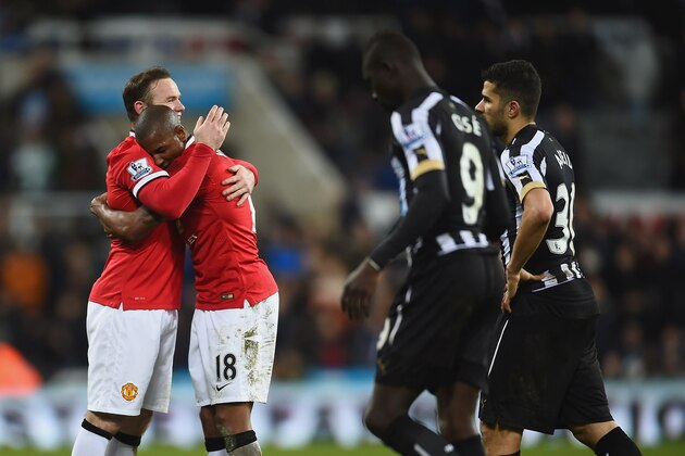 NEWCASTLE UPON TYNE, ENGLAND - MARCH 04:  Wayne Rooney of Manchester United hugs Ashley Young of Manchester United after victory in the Barclays Premier League match between Newcastle United and Manchester United at St James' Park on March 4, 2015 in Newcastle upon Tyne, England.  (Photo by Laurence Griffiths/Getty Images)