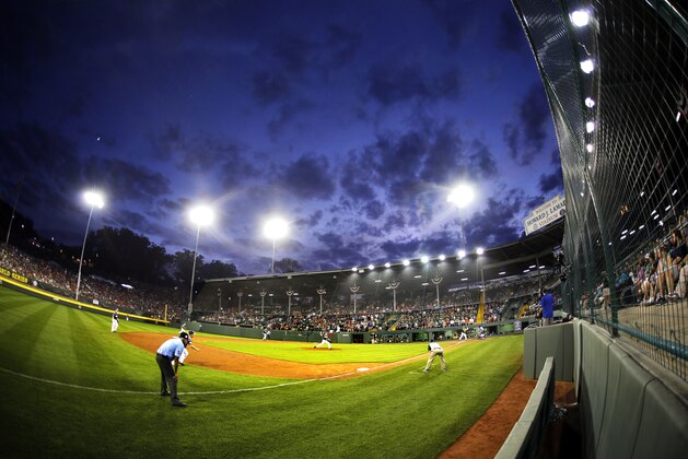 The sun goes down on Lamade Stadium during a baseball game in United States pool play between Webb City, Missouri and Lewisberry, Pennsylvania at the Little League World Series tournament in South Williamsport, Pa., Friday, Aug. 21, 2015. Pennsylvania won 18-0. (AP Photo/Gene J. Puskar)