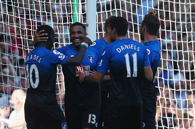 LONDON, ENGLAND - AUGUST 22:  Callum Wilson (2nd L) of Bournemouth celebrates scoring his team's fourth goal from the penalty spot to make a hat trick with his team mates during the Barclays Premier League match between West Ham United and A.F.C. Bournemouth at the Boleyn Ground on August 22, 2015 in London, England.  (Photo by Charlie Crowhurst/Getty Images)