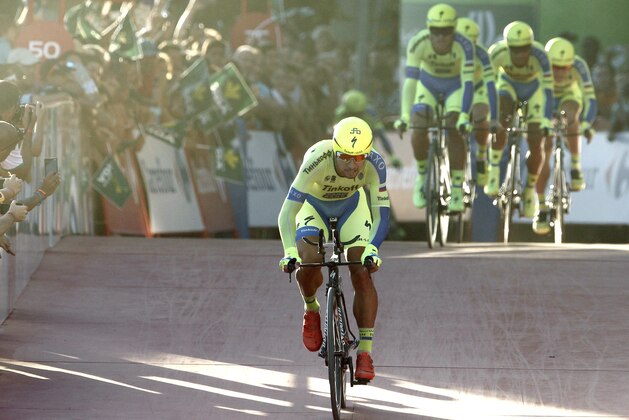 Tinkoff-Saxo team rides during the first stage of the 2015 Vuelta Espana cycling tour, a 7.4 kilometre race-against-the-clock between Puerto Banus Marina and Marbella on August 22, 2015. Tour of Spain organisers announced yesterday that the first stage will not count towards the overall standings after riders raised safety concerns as the coastal route includes cycling over a narrow wooden bridge and a potentially hazardous dirt track . AFP PHOTO/JOSE JORDAN        (Photo credit should read JOSE JORDAN/AFP/Getty Images)