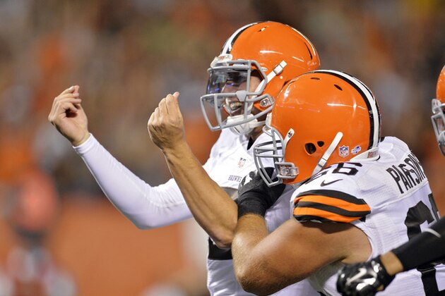 Cleveland Browns quarterback Johnny Manziel celebrates after a 7-yard touchdown run against the St. Louis Rams in the third quarter of a preseason NFL football game Saturday, Aug. 23, 2014, in Cleveland. (AP Photo/David Richard)