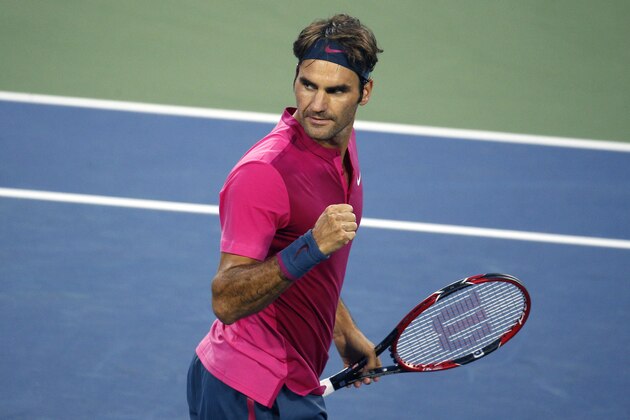 Roger Federer, of Switzerland, reacts after defeating Feliciano Lopez, of Spain, 6-3, 6-4 at the Western & Southern Open tennis tournament, Friday, Aug. 21, 2015, in Mason, Ohio. (AP Photo/John Minchillo)