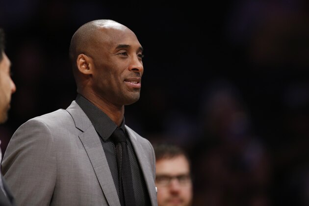 Los Angeles Lakers' Kobe Bryant, who is injured, attends an NBA Basketball game against the New York Knicks, Thursday, March 12, 2015, in Los Angeles. The Knicks won 101-94. (AP Photo/Danny Moloshok)