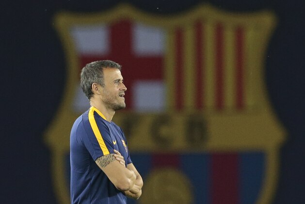 Barcelona’s coach Luis Enrique watches his players during team's training session at the Boris Paichadze Dinamo Arena stadium, in Tbilisi, Georgia, Monday, Aug. 10, 2015. Tbilisi hosts the Super Cup soccer match between Barcelona and Sevilla, which will be played on Tuesday. (AP Photo/Ivan Sekretarev)