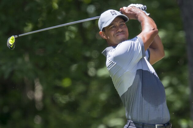Tiger Woods tees off on the second hole during the third round of the Wyndham Championship golf tournament at Sedgefield Country Club in Greensboro, N.C., Saturday, Aug. 22, 2015. (AP Photo/Rob Brown)