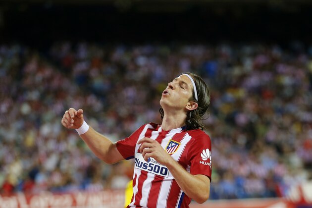 Atletico Madrid's Filipe Luis reacts after missing a chance during the Spanish La Liga soccer match between Atletico Madrid and Las Palmas at the Vicente Calderon stadium in Madrid, Spain, Saturday, Aug. 22, 2015. Atletico Madrid won 1-0. (AP Photo/Francisco Seco)