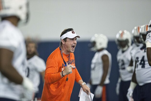 FILE - In this Aug. 4, 2015, file photo, Auburn's defensive coordinator Will Muschamp screams at a player during an NCAA college football practice in Auburn, Ala. There are 14 new coordinators around the league, including Muschamp at Auburn. (AP Photo/Brynn Anderson, File)
