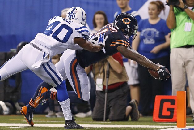 Chicago Bears wide receiver Josh Bellamy (11) dives in for a touchdown in front of Indianapolis Colts cornerback Sheldon Price (40) during the second half of an NFL preseason football game in Indianapolis, Saturday, Aug. 22, 2015. (AP Photo/Sam Riche)