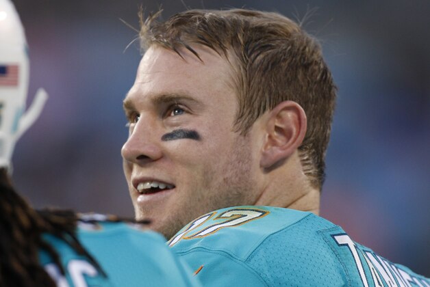 Miami Dolphins' Ryan Tannehill (17) watches from the sidelines during the first half of an NFL preseason football game against the Carolina Panthers  in Charlotte, N.C., Saturday, Aug. 22, 2015. (AP Photo/Bob Leverone)