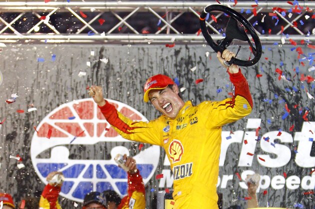 Joey Logano celabrates in Victory Lane after winning the NASCAR Sprint Cup Series auto race, Saturday, Aug. 22, 2015, in Bristol, Tenn. (AP Photo/Wade Payne)