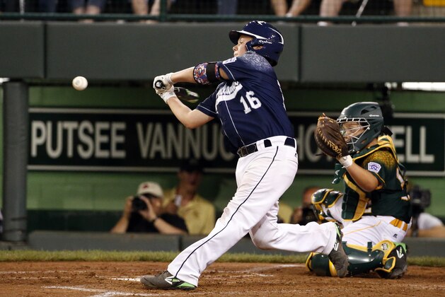 Lewisberry, Pennsylvania's Kaden Peifer strides into a pitch from Webb City, Missouri's Devrin Weathers for a three-run home run during the second inning of a baseball game in United States pool play at the Little League World Series tournament in South Williamsport, Pa., Friday, Aug. 21, 2015. (AP Photo/Gene J. Puskar)
