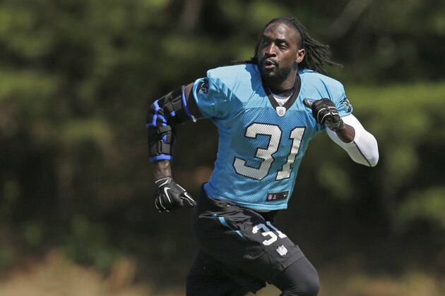 Carolina Panthers' Charles Tillman (31) runs a drill during the NFL football team's training camp in Spartanburg, S.C., Saturday, Aug. 1, 2015. (AP Photo/Chuck Burton)