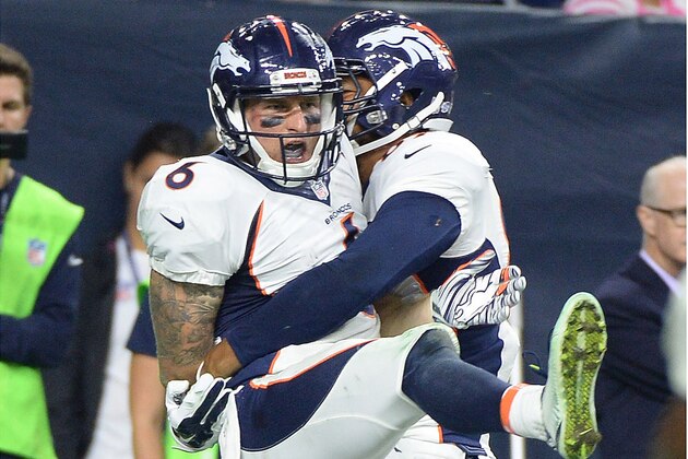 Denver Broncos' Corbin Louks (6) is lifted by teammate Mike McFarland (89) after he scored a touchdown against the Houston Texans during the second half of an NFL preseason football game, Saturday, Aug. 22, 2015, in Houston. (AP Photo/George Bridges)