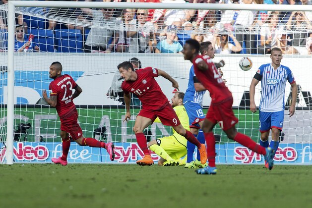 Bayern's Robert Lewandowski, center, celebrates after scoring his side's second goal during the Germany Soccer Bundesliga match between TSG Hoffenheim and Bayern Munich in Sinsheim, southern Germany, on Aug. 22, 2015. (AP Photo/Daniel Maurer)