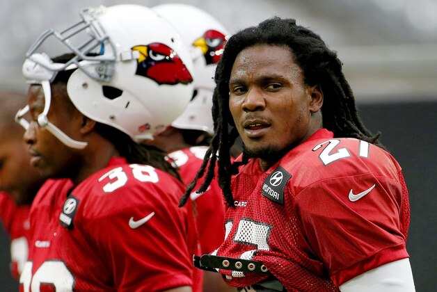 Arizona Cardinals running back Chris Johnson participates in an NFL football training camp, Tuesday, Aug. 18, 2015, in Glendale, Ariz. (AP Photo/Matt York)