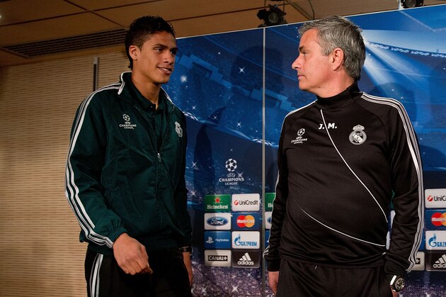 MADRID, SPAIN - APRIL 02:  Head coach Jose Mourinho (R) and Real madrid player Raphael varane prior to start a press conference ahead of the UEFA Champions League Quarterfinal match between Real Madrid and Galatasaray AS at Santiago Bernabeu Stadium on April 2, 2013 in Madrid, Spain.  (Photo by Gonzalo Arroyo Moreno/Getty Images)