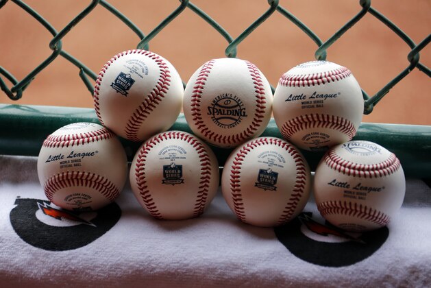 A pile of Little League baseballs wait to go be used during an International elimination baseball game at the Little League World Series tournament in South Williamsport, Pa., Saturday, Aug. 22, 2015. (AP Photo/Gene J. Puskar)