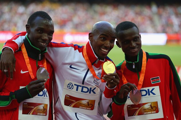 BEIJING, CHINA - AUGUST 23:  (L-R) Silver medalist Geoffrey Kipsang Kamworor of Kenya, gold medalist Mohamed Farah of Great Britain and bronze medalist Paul Kipngetich Tanui of Kenya pose on the podium during the medal ceremony for the Men's 10000 metres during day two of the 15th IAAF World Athletics Championships Beijing 2015 at Beijing National Stadium on August 23, 2015 in Beijing, China.  (Photo by Alexander Hassenstein/Getty Images for IAAF)