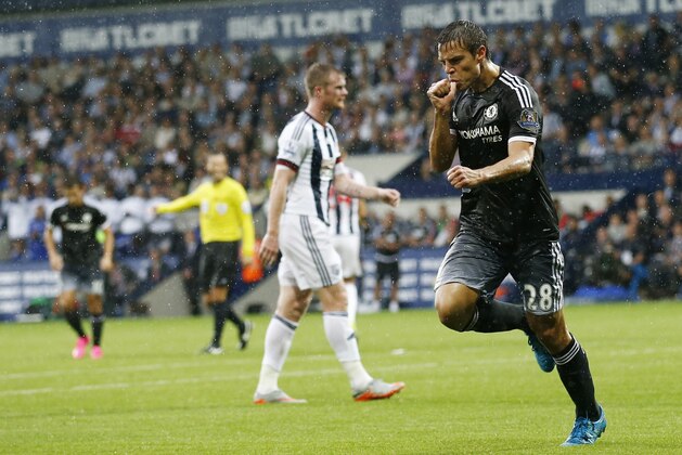 Chelsea's Spanish defender Cesar Azpilicueta (R) celebrates after scoring their third goal during the English Premier League football match between West Bromwich Albion and Chelsea at The Hawthorns in West Bromwich, central England on August 23, 2015. AFP PHOTO / JUSTIN TALLIS

RESTRICTED TO EDITORIAL USE. No use with unauthorized audio, video, data, fixture lists, club/league logos or 'live' services. Online in-match use limited to 75 images, no video emulation. No use in betting, games or single club/league/player publications.        (Photo credit should read JUSTIN TALLIS/AFP/Getty Images)